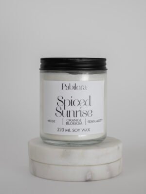 Pabilora Spiced Sunrise scented candle blending orange blossom, Moroccan spices, fruity mandarin tea, and a seductive musk finish.